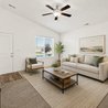 Living room with vaulted ceiling, ceiling fan, and front window