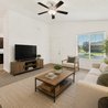 Furnished living room with view into the kitchen and front entry